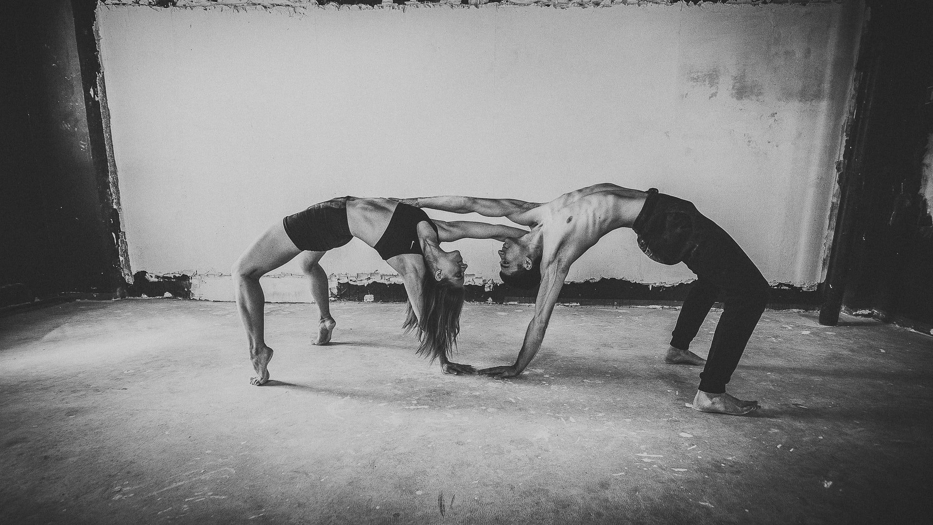 Mand and woman doing yoga together